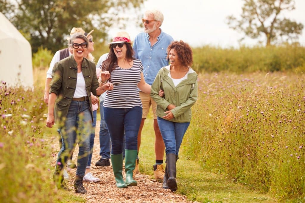 a group of people walking on a path